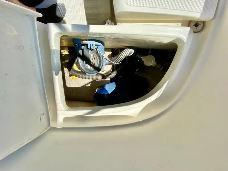 Slide: The Image of 1998 Pacific Seacraft 37 engine compartment with visible wiring and components. - 12
