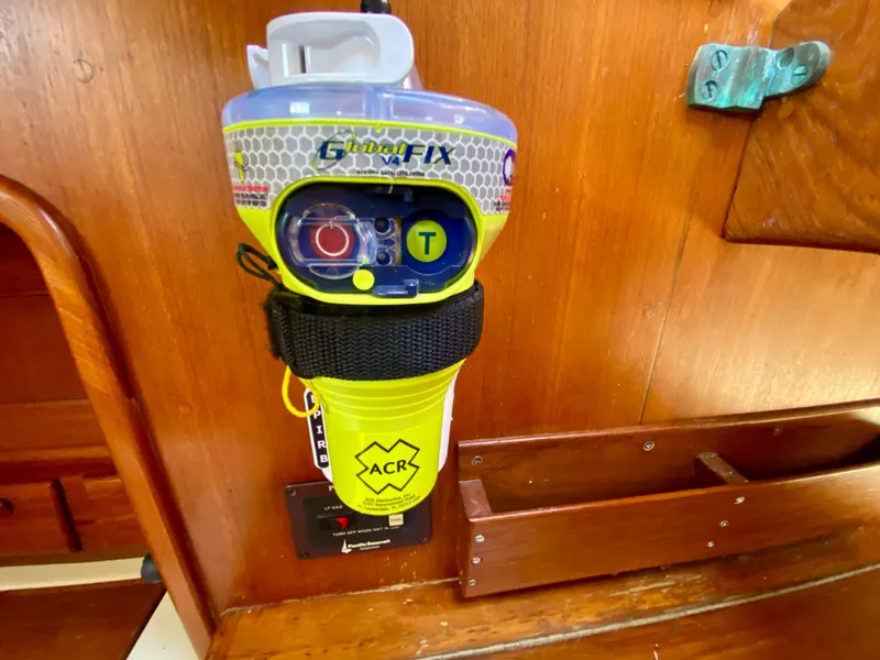 Slide: The Image of Emergency beacon mounted on a 1998 Pacific Seacraft 37 sailboat interior. - 17