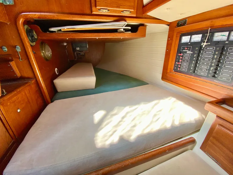 Slide: The Image of Interior cabin of 1998 Pacific Seacraft 37 sailboat with wooden finish and control panel. - 39
