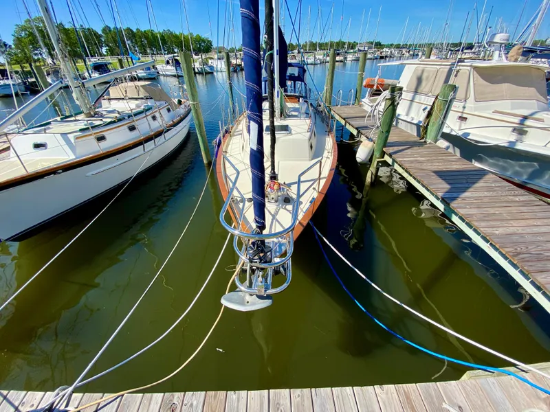 Slide: The Image of Sailboat docked at marina, Pacific Seacraft 37, 1998 model, surrounded by other boats. - 45