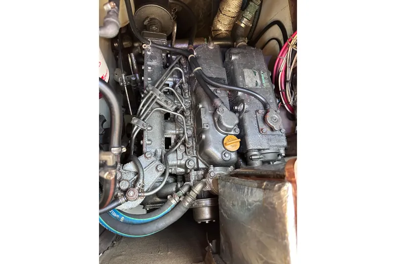 Slide: The Image of Engine of a 1998 Pacific Seacraft 37 sailboat, showcasing intricate mechanical components. - 47