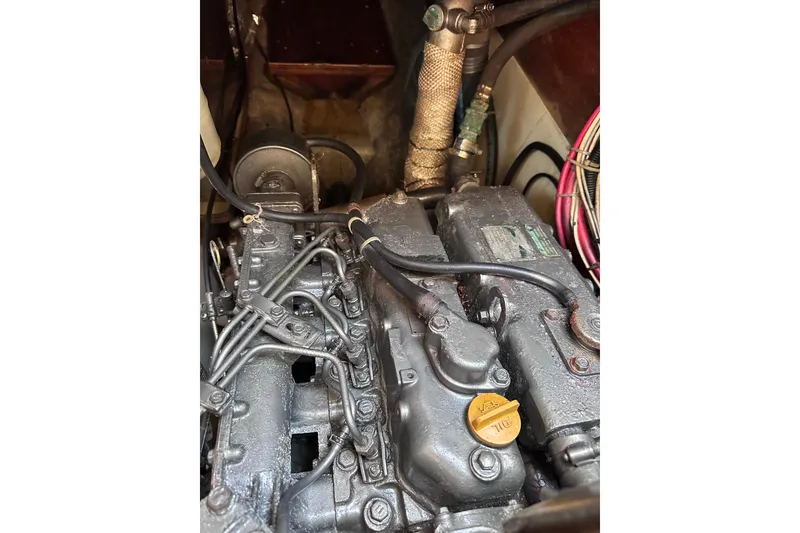 Slide: The Image of Engine compartment of a 1998 Pacific Seacraft 37 sailboat, showing detailed components. - 48