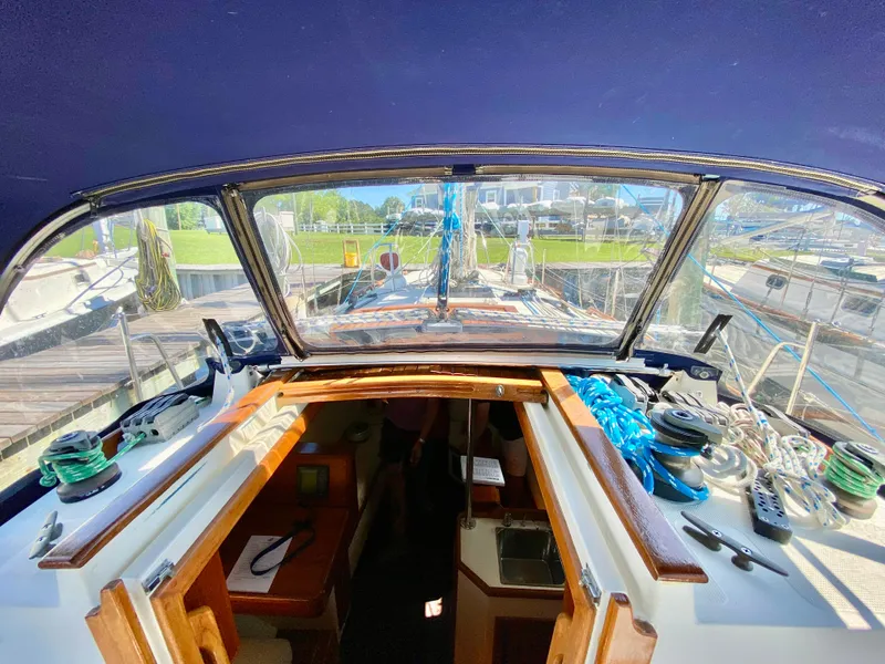 Slide: The Image of 1998 Pacific Seacraft 37 sailboat cockpit view with open cabin and deck equipment. - 5