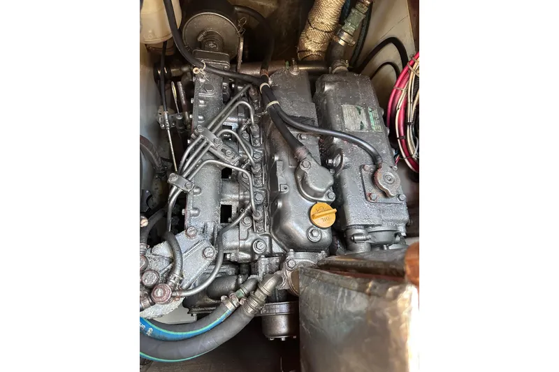 Slide: The Image of Engine of a 1998 Pacific Seacraft 37 sailboat, showcasing intricate mechanical components. - 50