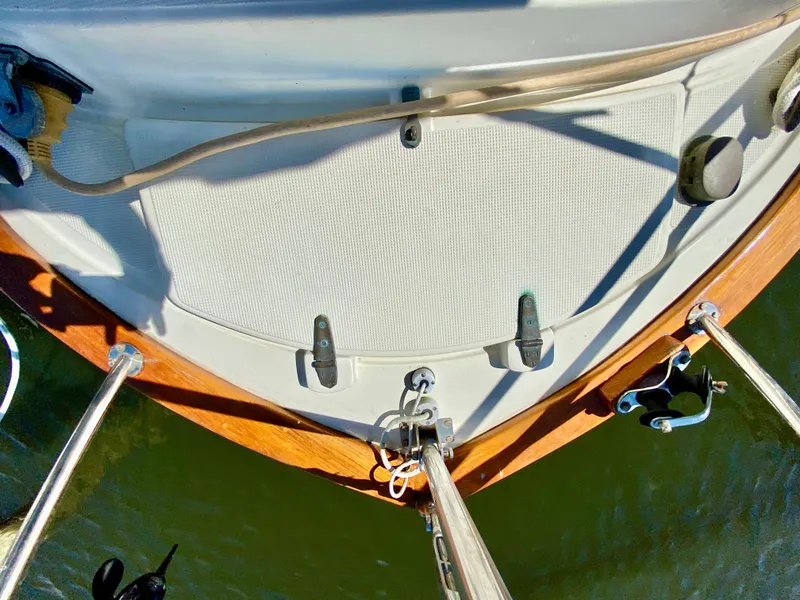 Slide: The Image of Deck view of a 1998 Pacific Seacraft 37 sailboat, featuring wooden trim and rigging. - 9