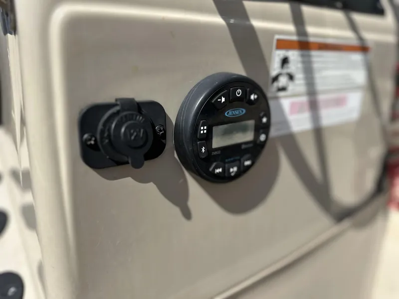 Slide: The Image of Control panel on 2020 G3 Bay 18 boat dashboard with digital display and socket. - 15