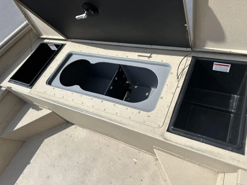 Slide: The Image of 2020 G3 Bay 18 boat storage compartments with open lids and key lock. - 4