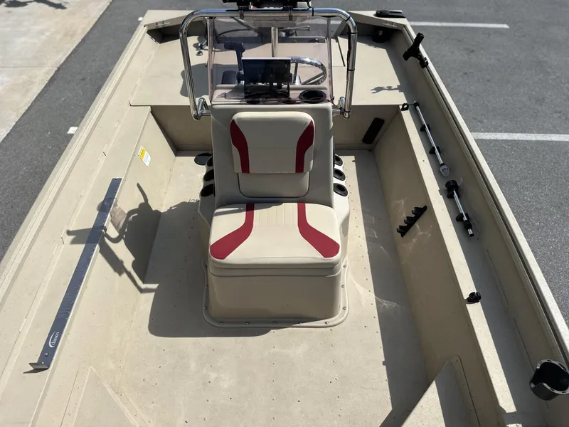 Slide: The Image of 2020 G3 Bay 18 boat interior with beige and red seating, steering console, and fishing rod holders. - 7