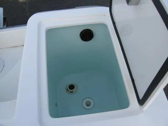 Slide: The Image of Open storage compartment on 2023 Edgewater 245CC boat. - 4