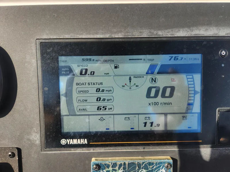 Slide: The Image of Yamaha boat dashboard display on 2021 Everglades 243 Center Console, showing speed and fuel status. - 15