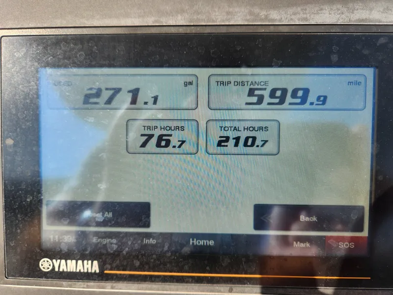 Slide: The Image of Display screen showing trip data: 271.1 gallons, 599.9 miles, 76.7 trip hours, 210.7 total hours. - 17