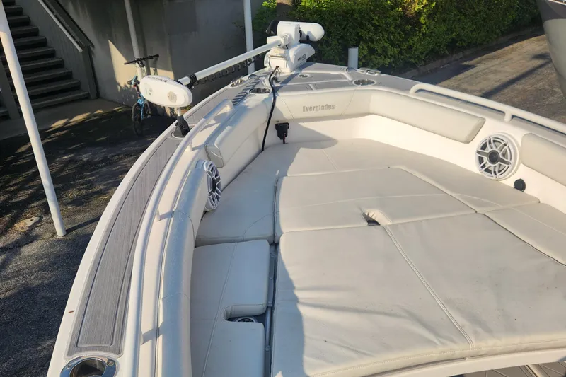 Slide: The Image of 2021 Everglades 243 Center Console boat with cushioned seating and mounted equipment. - 19