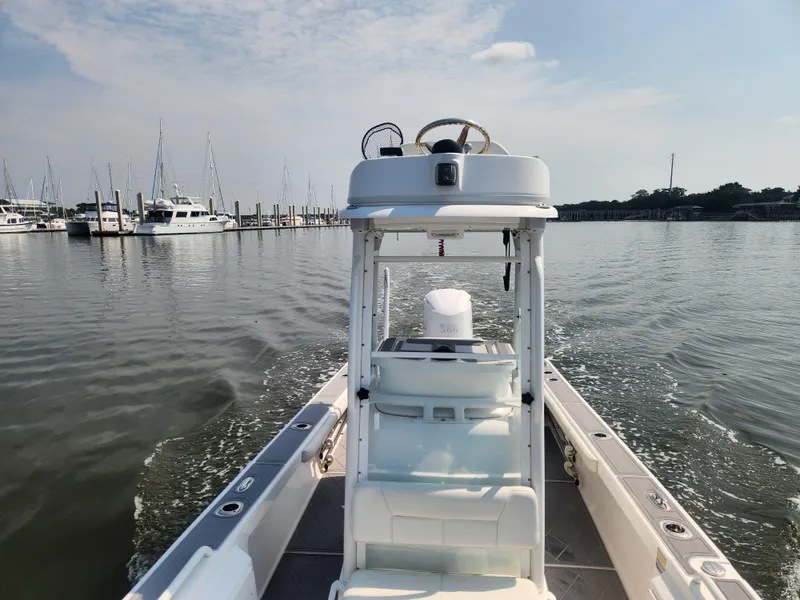 Slide: The Image of Everglades 243 Center Console boat cruising on calm waters, 2021 model. - 5