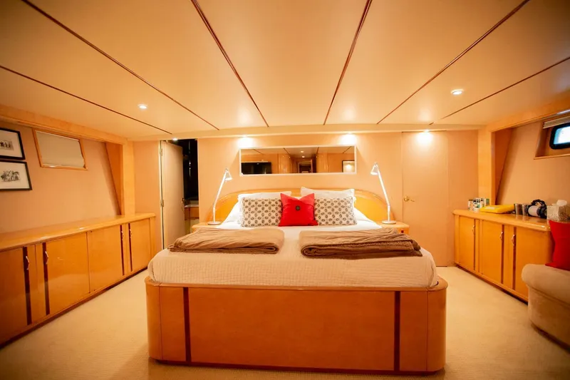 Slide: The Image of Luxurious bedroom interior of 1999 Tarrab motor yacht with elegant lighting and modern furnishings. - 17