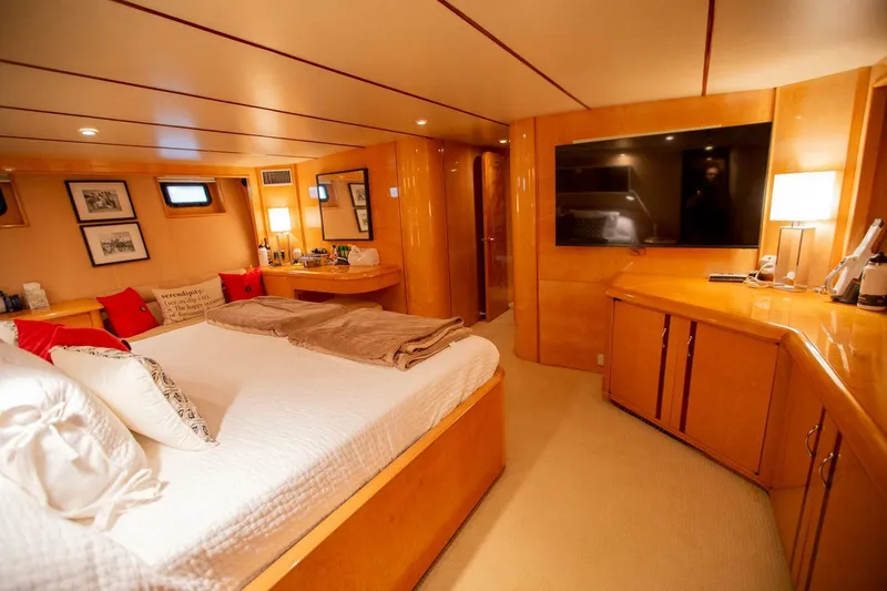 Slide: The Image of Luxurious bedroom interior of 1999 Tarrab Motor Yacht with modern amenities and elegant wood finish. - 21