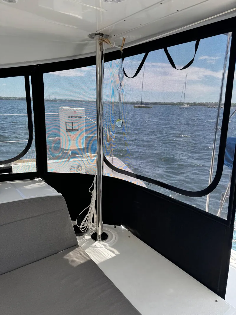Slide: The Image of Interior view of 2016 Lagoon 450S catamaran with ocean backdrop. - 10
