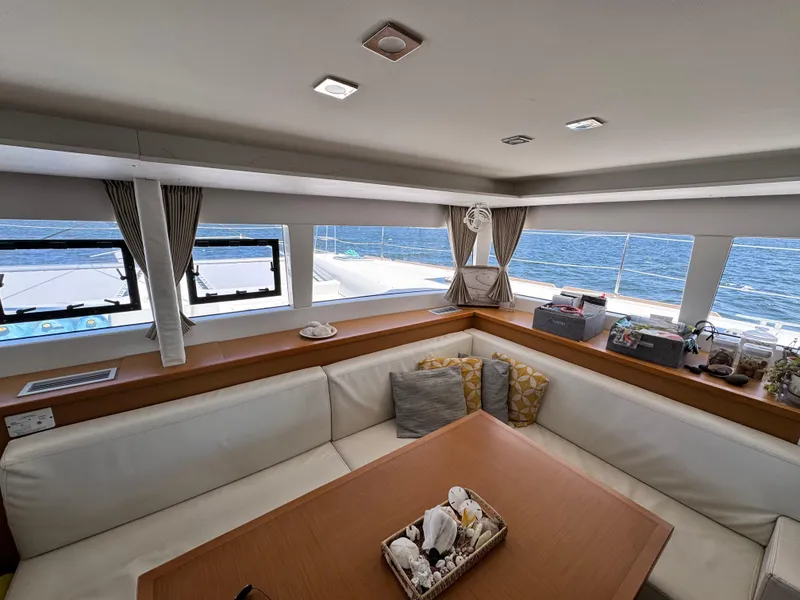 Slide: The Image of Interior of 2016 Lagoon 450S yacht with ocean view through windows. - 14