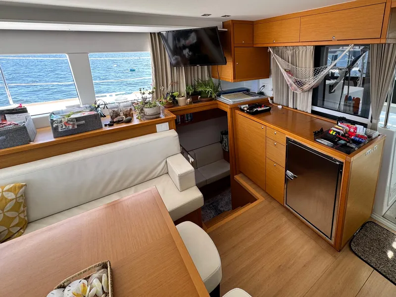 Slide: The Image of Interior of 2016 Lagoon 450S yacht with modern furnishings and ocean view. - 17