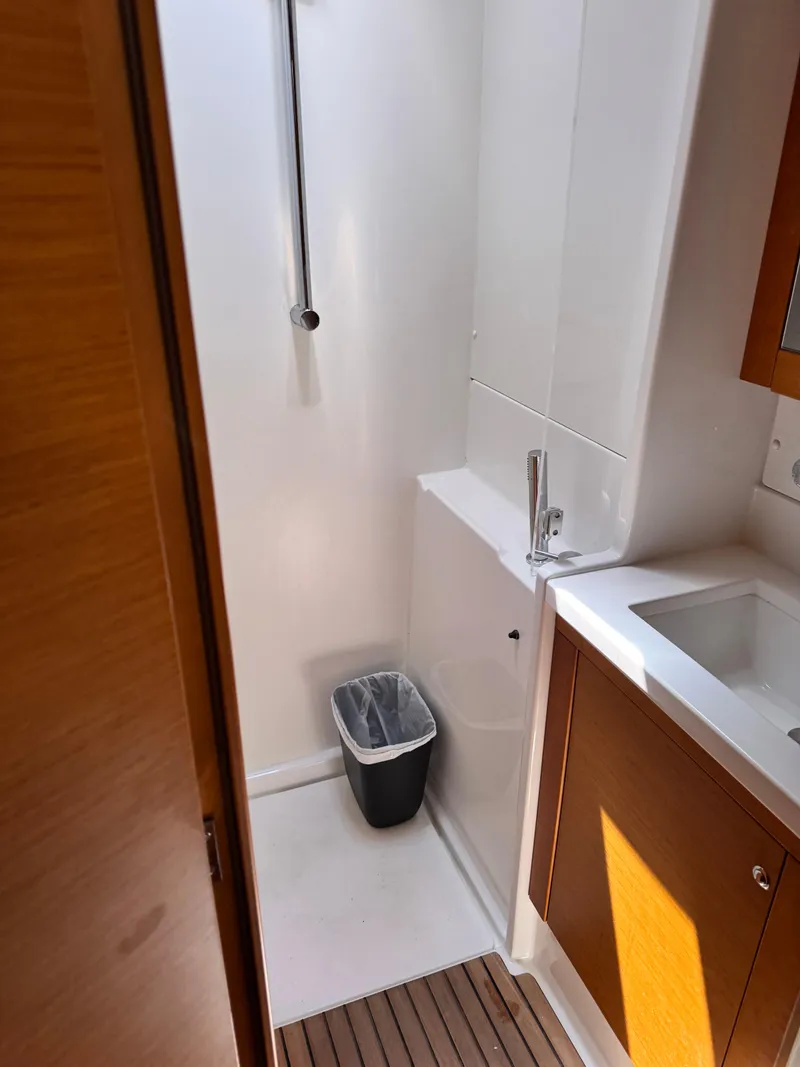 Slide: The Image of Bathroom interior of 2016 Lagoon 450S yacht, featuring sink and shower area. - 23