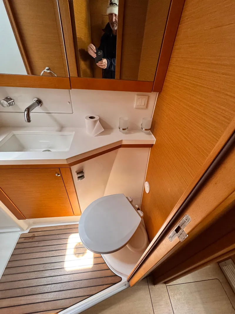 Slide: The Image of Bathroom interior of 2016 Lagoon 450S yacht with wooden accents and modern fixtures. - 24