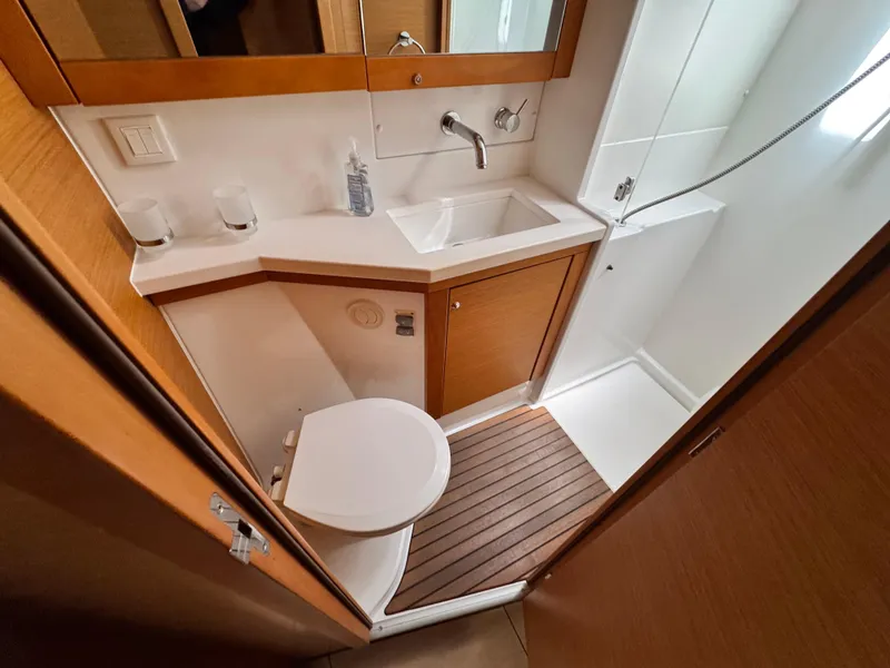 Slide: The Image of Bathroom interior of 2016 Lagoon 450S yacht with shower, sink, and toilet. - 27
