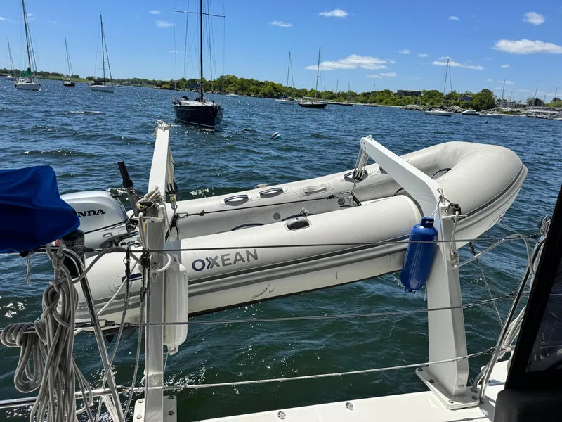 Slide: The Image of Inflatable dinghy on Lagoon 450S yacht, 2016 model, anchored in a scenic bay. - 3