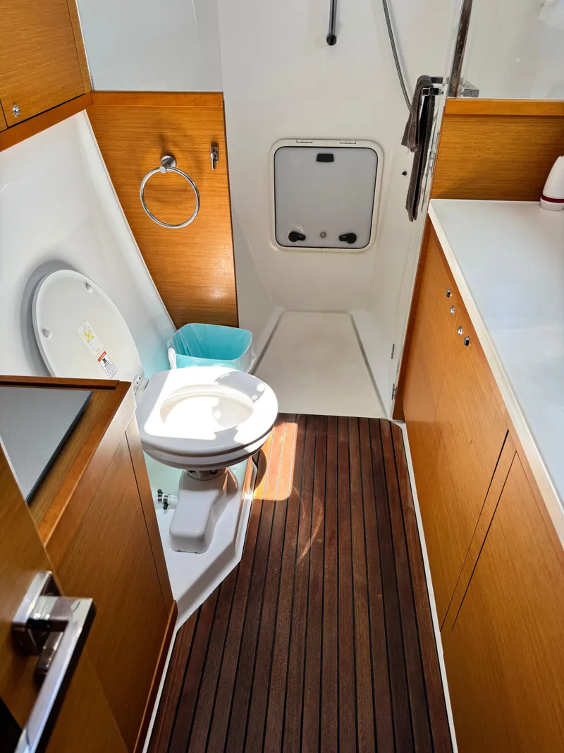 Slide: The Image of 2016 Lagoon 450S yacht bathroom with wooden flooring and modern fixtures. - 32