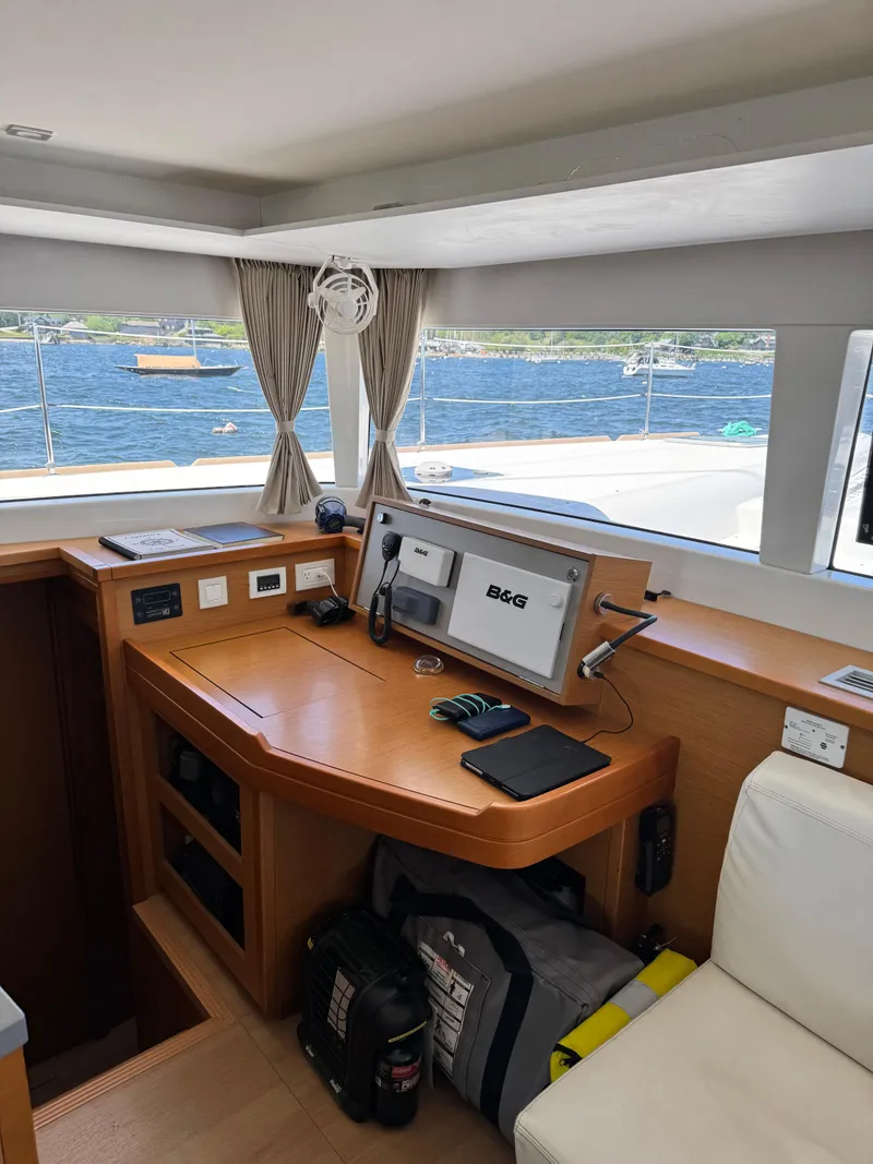 Slide: The Image of Interior of 2016 Lagoon 450S yacht with navigation equipment and scenic ocean view. - 38
