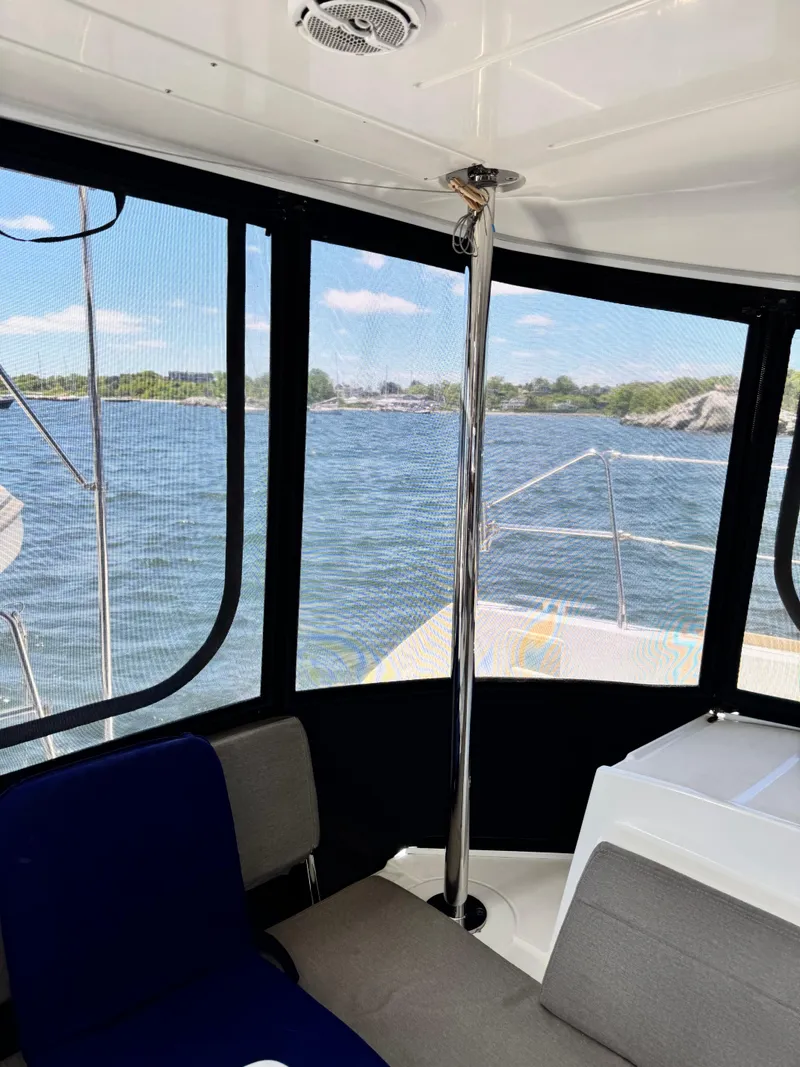 Slide: The Image of Interior view of 2016 Lagoon 450S yacht with ocean and coastline visible through windows. - 41