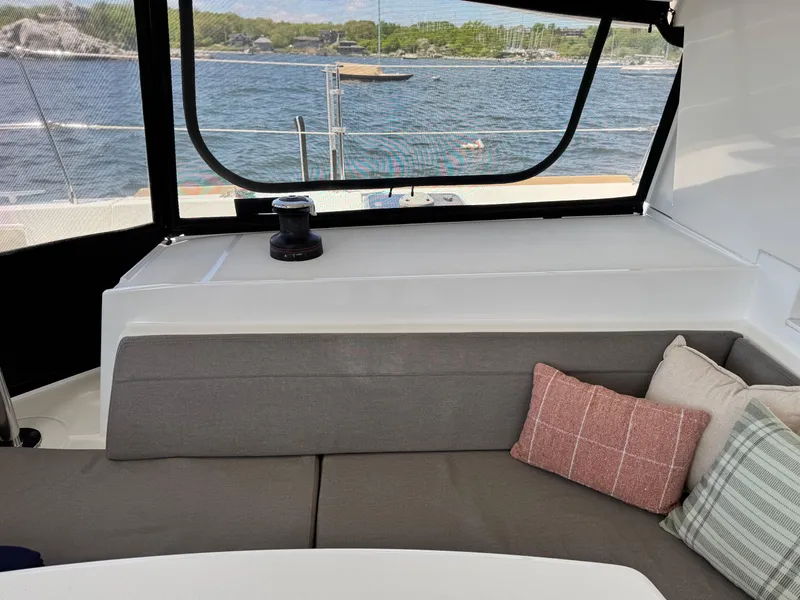 Slide: The Image of Interior of 2016 Lagoon 450S yacht with comfortable seating and scenic water view. - 45