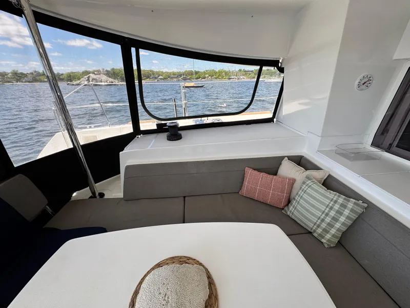 Slide: The Image of Interior of 2016 Lagoon 450S yacht with cozy seating and scenic water view. - 46