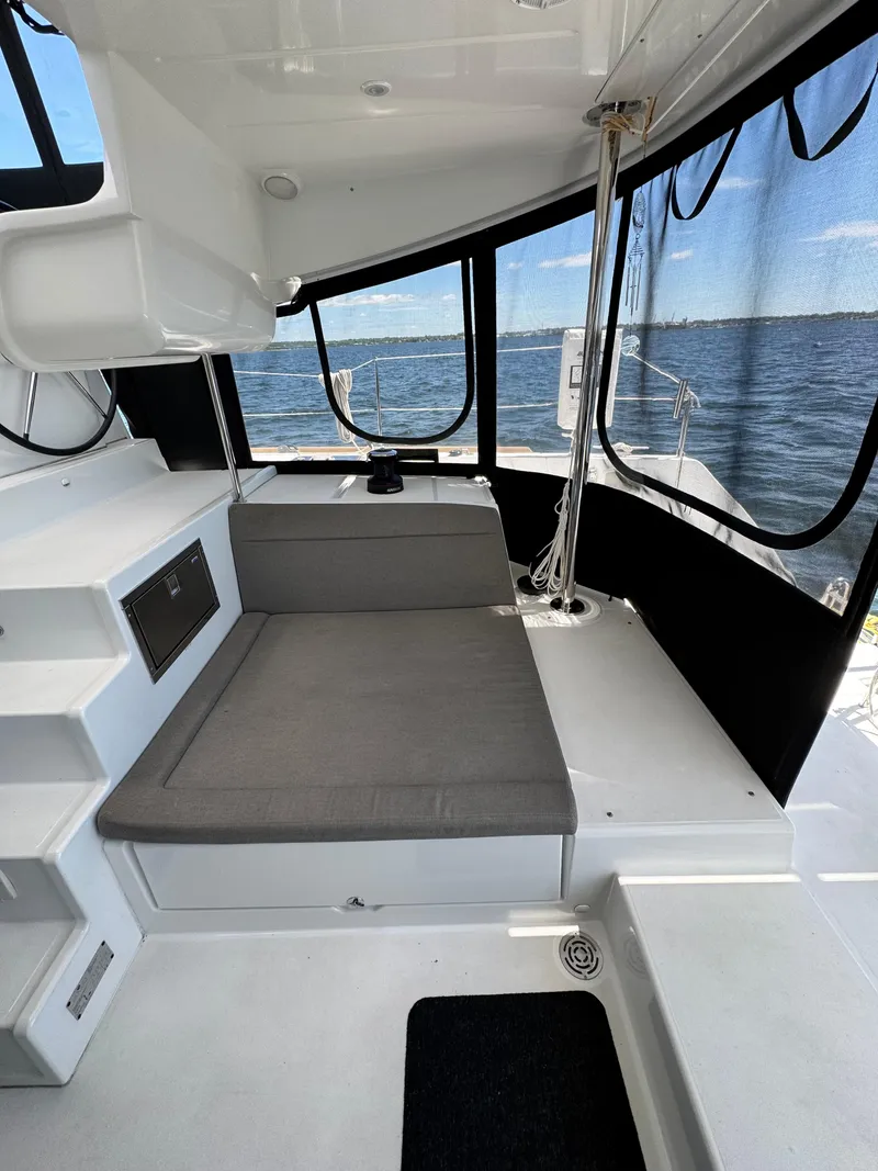 Slide: The Image of Interior view of 2016 Lagoon 450S catamaran with seating and ocean backdrop. - 47