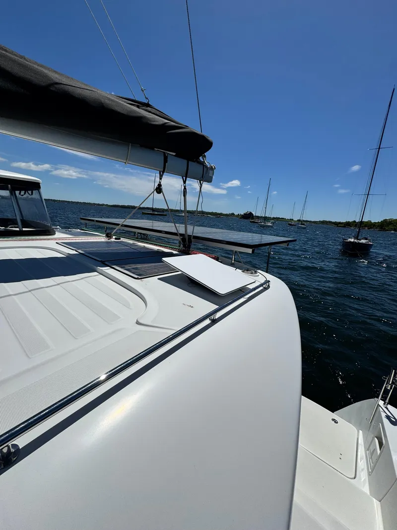 Slide: The Image of 2016 Lagoon 450S catamaran sailing on a sunny day with clear blue skies. - 6