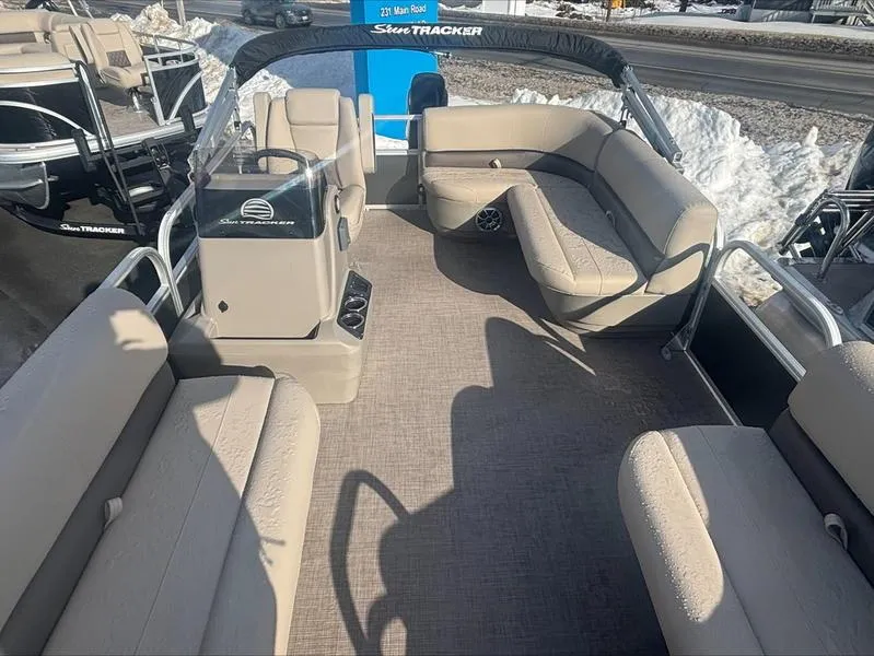 Slide: The Image of 2025 Sun Tracker PB 16 DLX pontoon boat with spacious seating and modern design. - 5