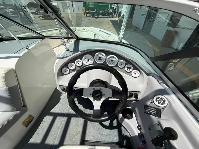 Slide: The Image of 2000 MasterCraft XStar boat dashboard with steering wheel and gauges. - 12