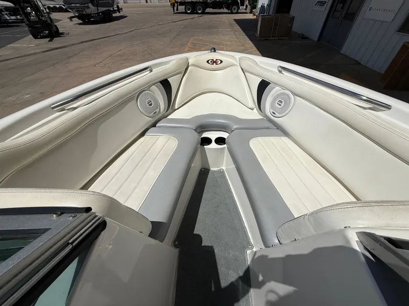 Slide: The Image of Interior of a 2000 MasterCraft XStar boat with white and gray seating. - 13
