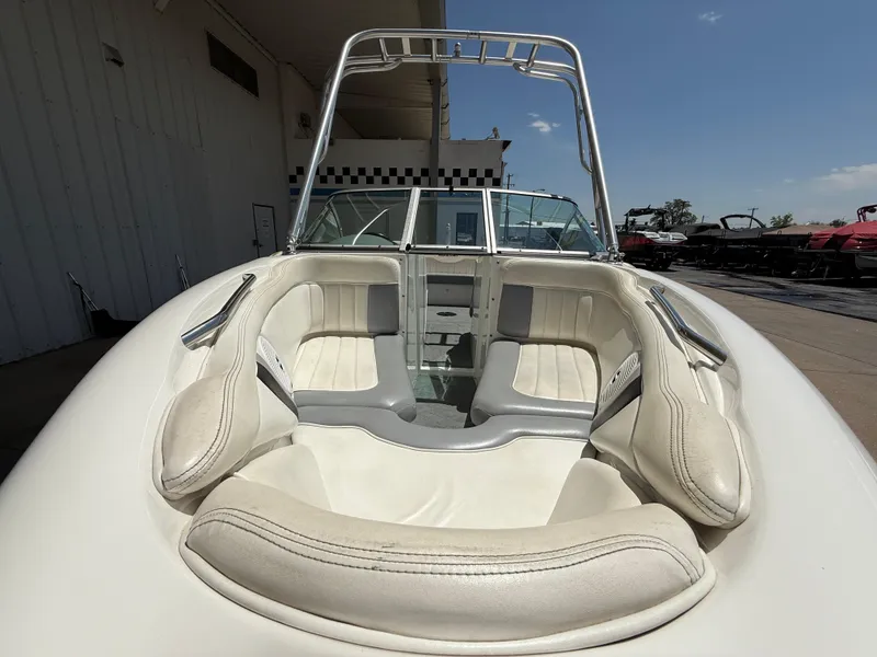 Slide: The Image of 2000 MasterCraft XStar boat interior with white seating and open bow design. - 3