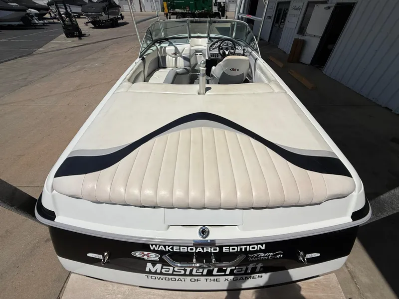 Slide: The Image of 2000 MasterCraft XStar wakeboard boat, rear view, white upholstery, "Wakeboard Edition" branding. - 9