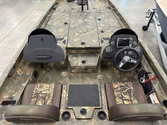 Slide: The Image of 2017 Ranger RT198P boat interior with camouflage design, featuring dual seats and a steering console. - 3