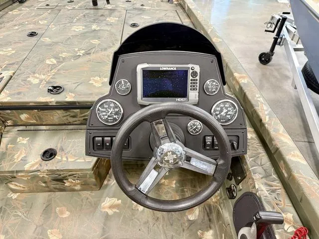 Slide: The Image of 2017 Ranger RT198P boat dashboard with Lowrance HDS display and camo design. - 5