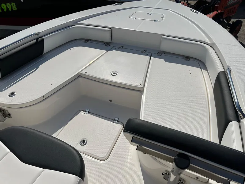 Slide: The Image of 2021 Robalo 226 Cayman boat deck with seating and storage compartments. - 15