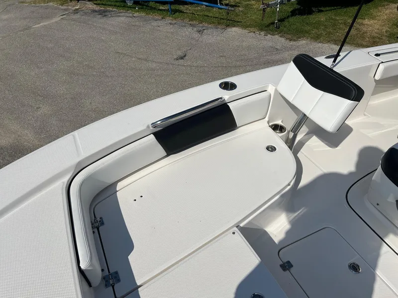 Slide: The Image of 2021 Robalo 226 Cayman boat deck with seating and storage compartments. - 19