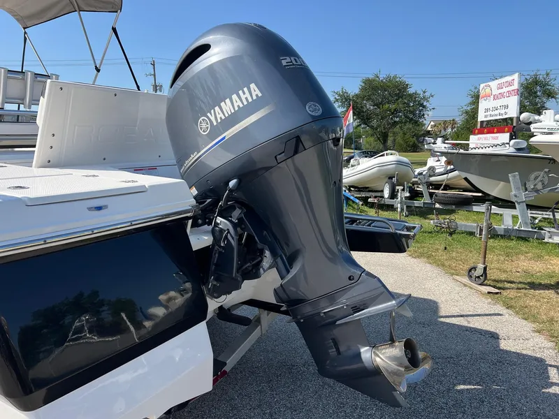 Slide: The Image of 2021 Robalo 226 Cayman boat with Yamaha outboard motor, displayed outdoors. - 4
