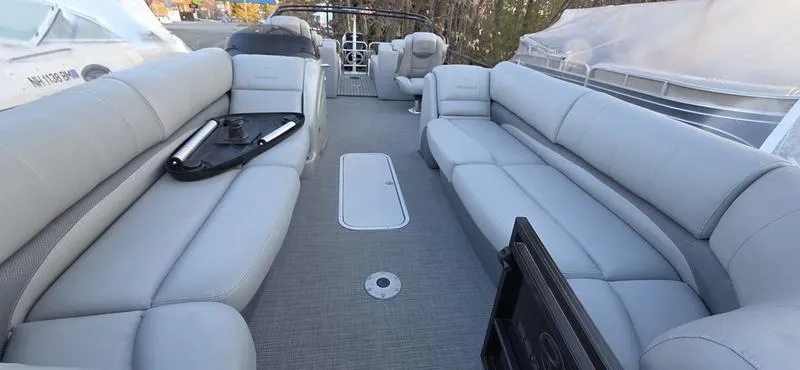 Slide: The Image of 2017 Regency 254 LE3 Sport pontoon boat interior with spacious seating and modern design. - 10