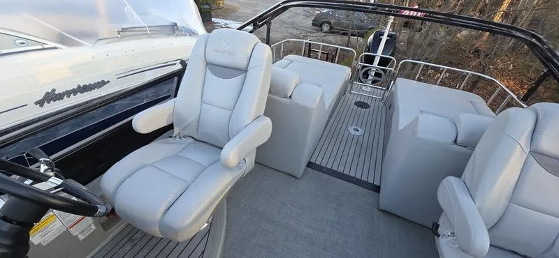 Slide: The Image of 2017 Regency 254 LE3 Sport boat interior with plush seating and sleek design. - 4