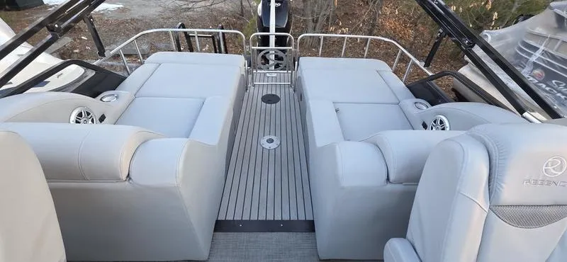 Slide: The Image of 2017 Regency 254 LE3 Sport boat interior with gray seating and sleek design. - 7