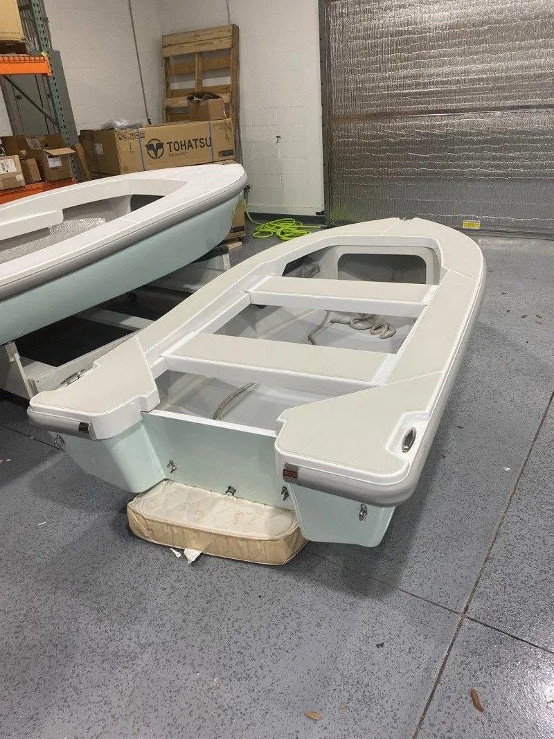 Slide: The Image of 2024 Ultra Lite Tenders ULT 300 boat in a warehouse setting. - 5