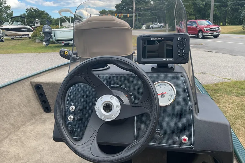 Slide: The Image of Steering console of 2025 Tracker BT CLASSIC SE boat with Lowrance display and RPM gauge. - 14