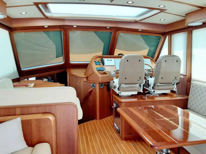 Slide: The Image of Interior of 2016 Sabre 48 Salon Express yacht with wooden finishes and helm station. - 11