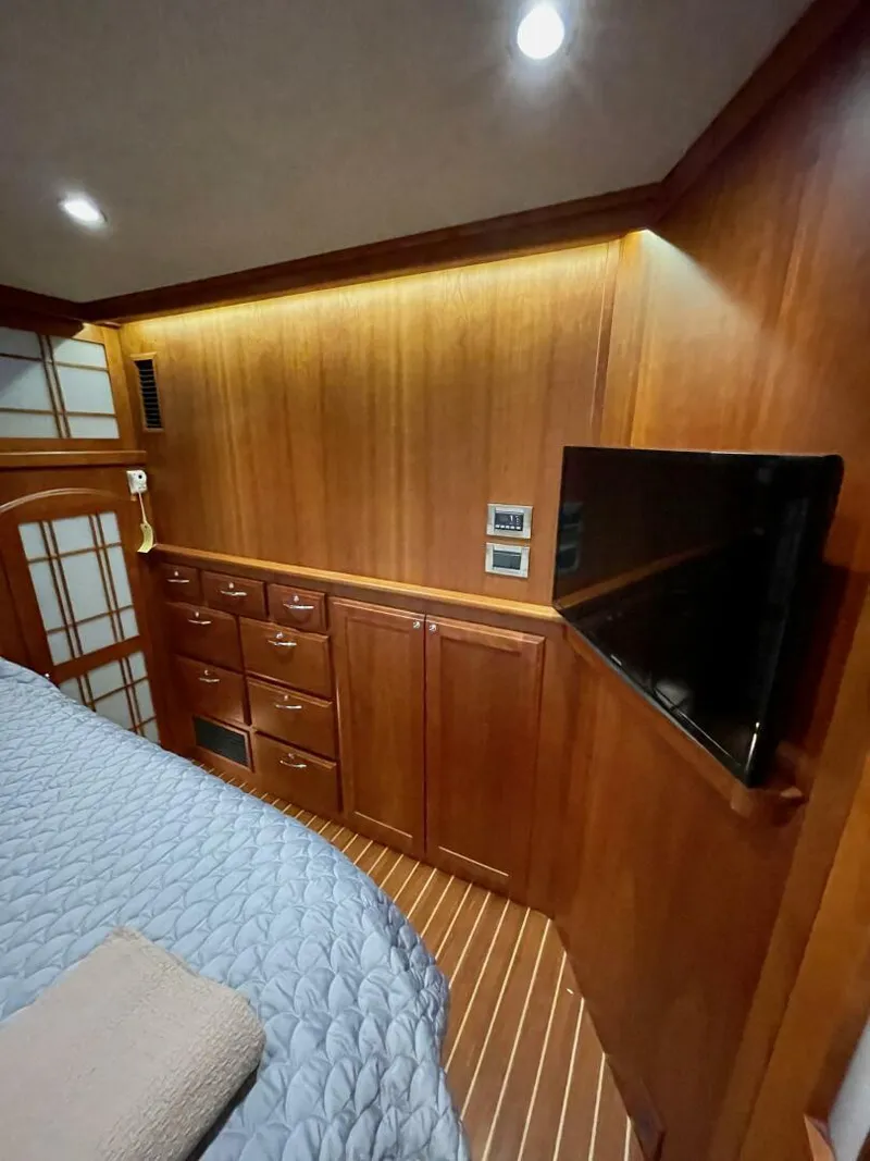 Slide: The Image of Interior of 2016 Sabre 48 Salon Express with wood paneling and modern amenities. - 38